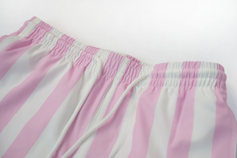pink striped swim shorts
