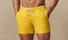 solid yellow swim shorts