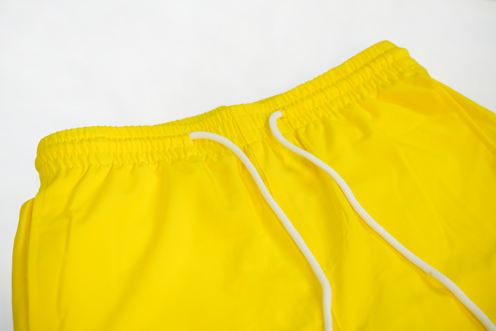 solid yellow swim shorts