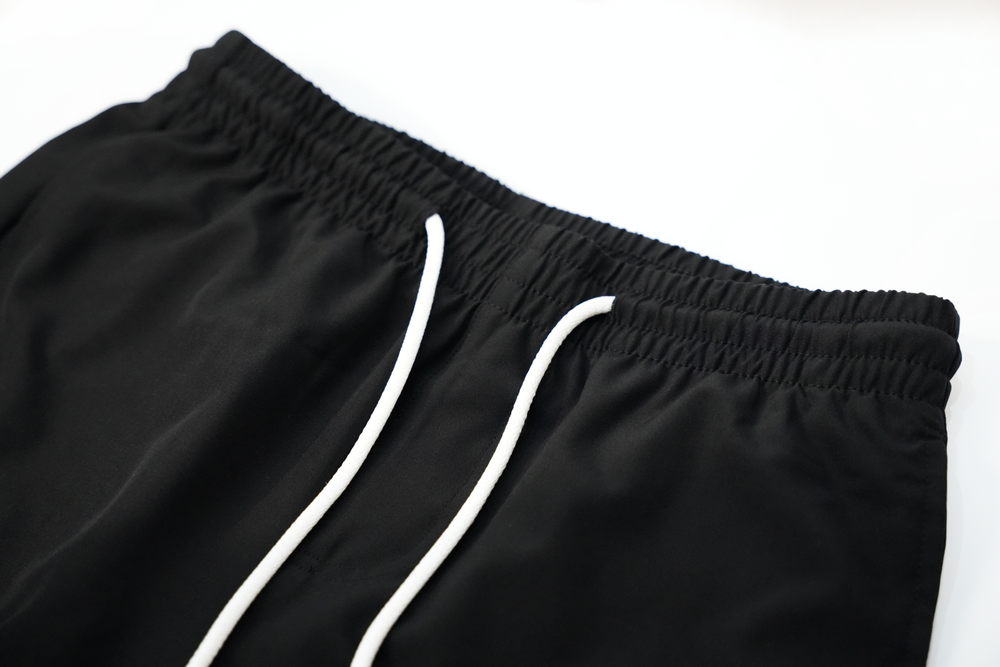 solid black swim shorts