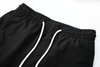 solid black swim shorts