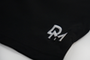 solid black swim shorts