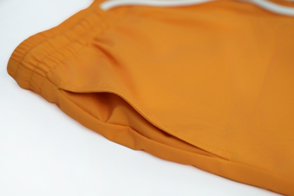 solid orange swim shorts